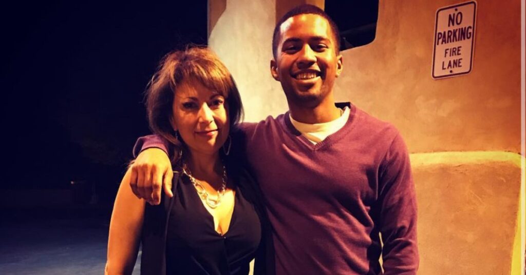 son and mom posing for a picture smiling
