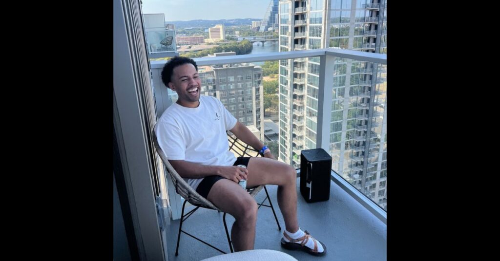 Austin city limits 2022 solo photo at hotel, smiling