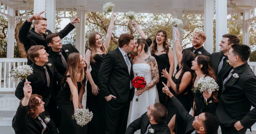 wedding celebration of couple with groomsman and maids of honor