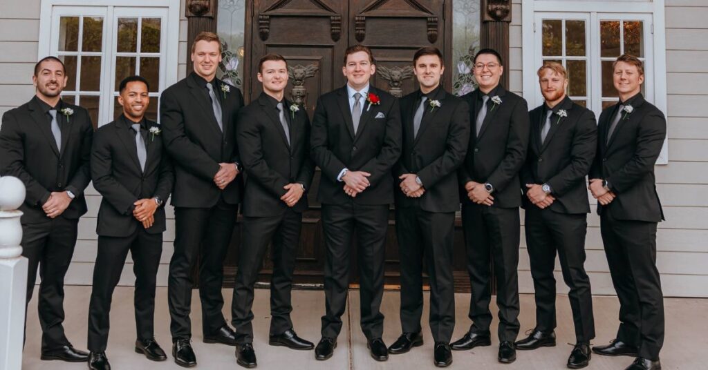 wedding groomsman in black with silver tie