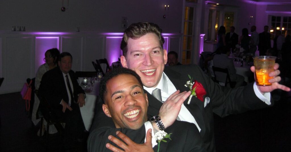 groom and groomsman having fun on dance floor and silliness
