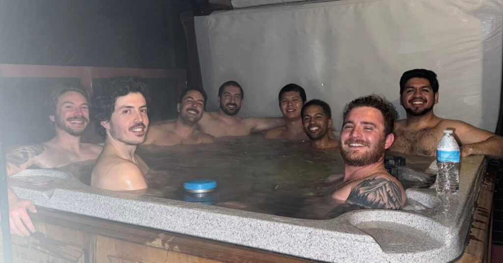 8 guys in a hot tub
