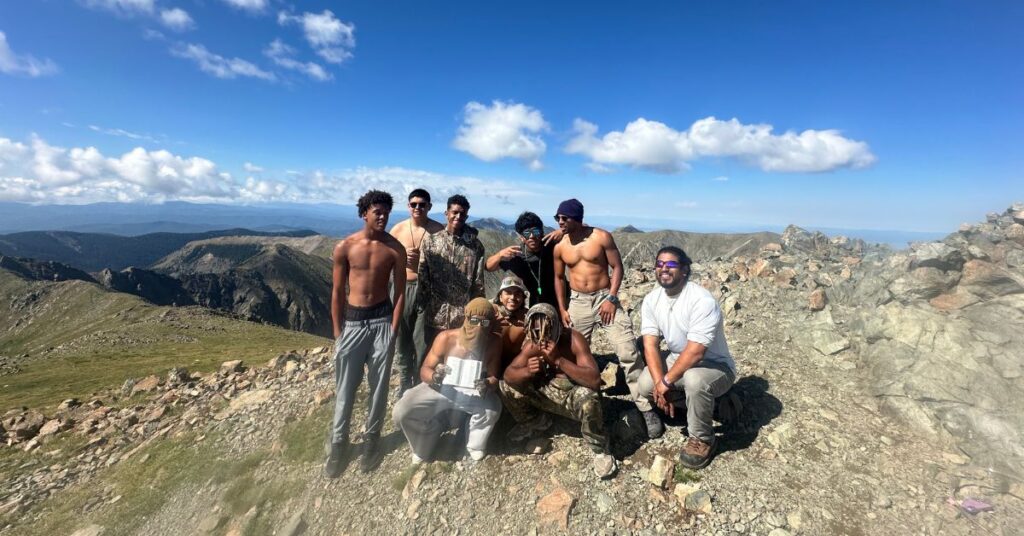 the boys, shirtless at 13,000 feet high