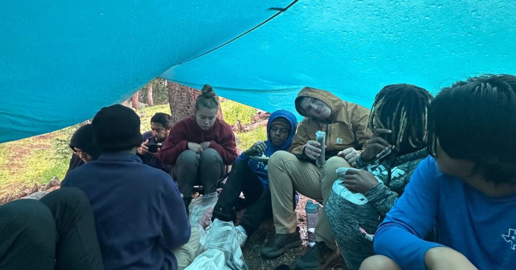 cold and wet under a canopy on camping trip