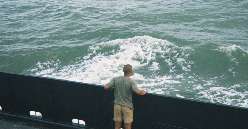 looking off the edge of a ferry to ocracoke into the vast ocean