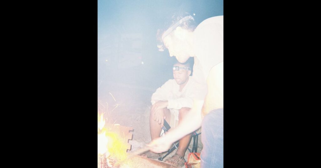 stoking the camp fire