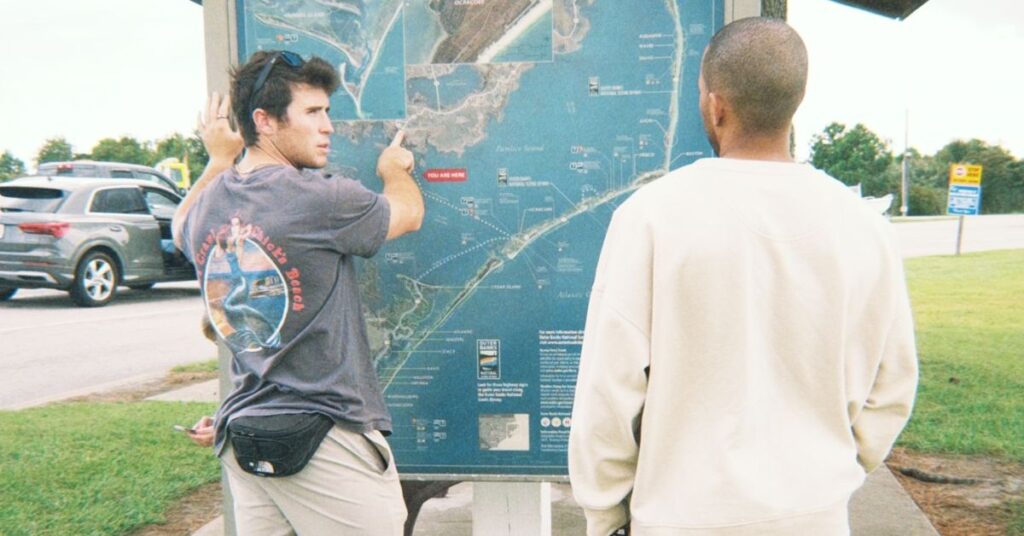 two friends planning out travel for road trip through north Caroline